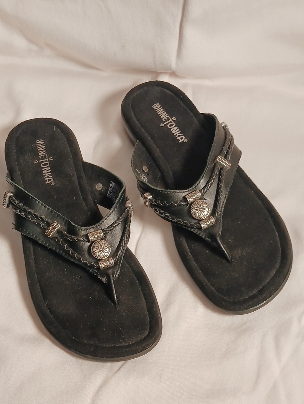 Minnetonka Black Braided Thong Sandals with Decorative Metal Accents